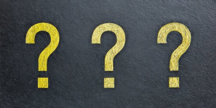 Golden question marks are displayed on a textured, dark background, representing inquiries and decisions.