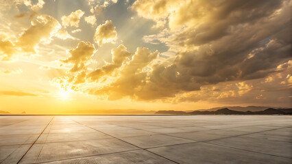 Dramatic golden sunset sky with textured clouds over a vast flat reflective landscape