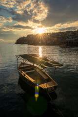 A small fishing boat and sunset on Lake Ohrid