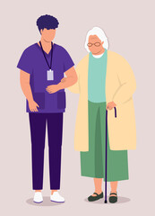 Fototapeta premium Male Nurse With Medical Scrubs Helping An Elderly Woman.