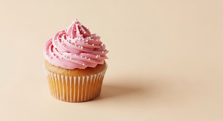 Delicate cupcake creation with pink frosting and sprinkle decoration
