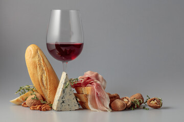 Red wine with traditional Mediterranean snacks.