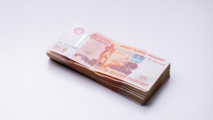 A stack of Russian banknotes with the number 5000 on them. Concept of wealth and prosperity