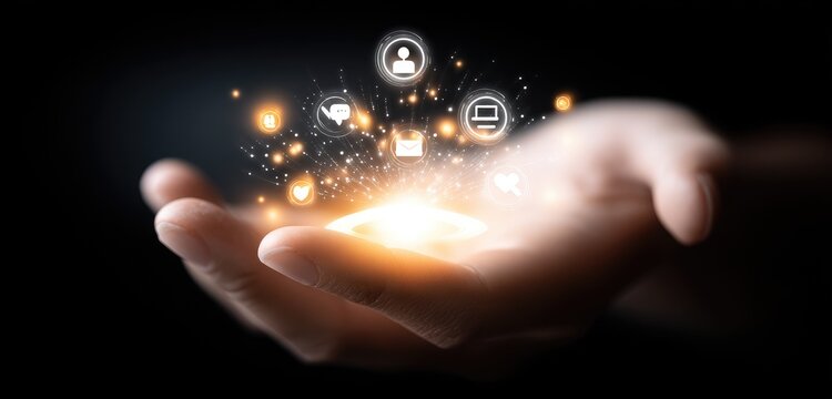 Hand holds glowing digital icons