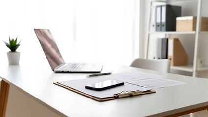 Bright and modern home office desk with laptop phone and documents ready for productive work