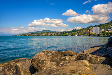 Montreux, Switzerland, with hillside buildings and Lake Geneva. Montreux is located in the centre of a region named the Vaud or Swiss Riviera.
