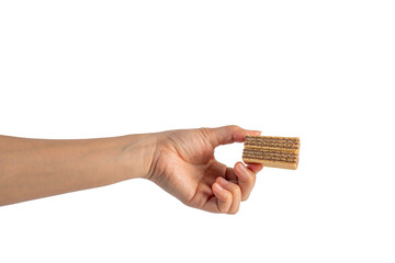 Wafer biscuit with chocolate cream and hand isolated on transparent background
