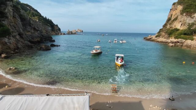 Paleokastritsa, Corfu Greece. 08.09.2025. Boat rentals on the beach of Corfu Island.