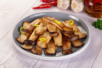 Roasted eringi mushrooms in the plate