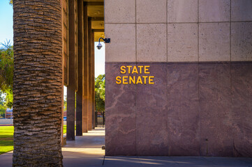 Exterior view of the Arizona State Senate building with signage in Phoenix.