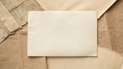 Collection of old papers showcasing blank copy space nestled among various textured sheets of...