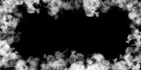  Isolated fluffy white cloud against a stark black background