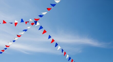 Festive Red, White, and Blue Pennant Flags Against a Clear Blue Sky