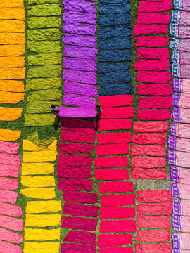 Narayanganj, Bangladesh - 01 October 2023: Aerial view of vibrant textiles stretch across the landscape, a mosaic of color under the sun, creating a breathtaking scene.
