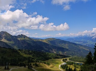 Panoramic Mountain View under Blue Sky and Clouds