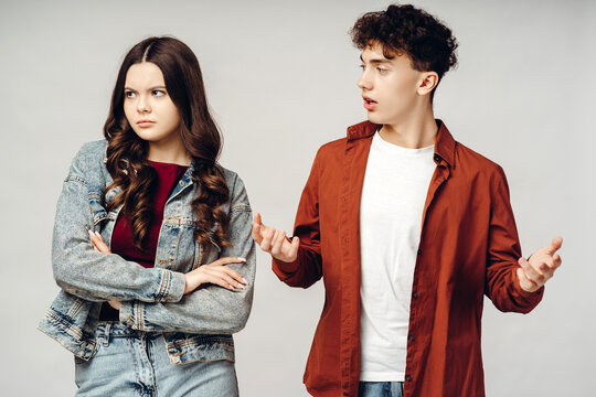 Young couple arguing with woman crossing arms and looking annoyed - Powered by Adobe