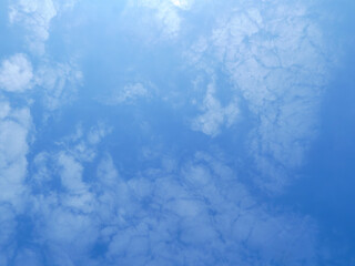 Fluffy White Clouds Against a Clear Blue Sky