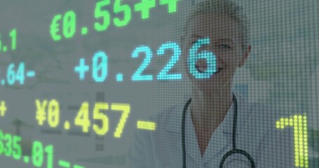 Analyzing doctor in lab coat and stethoscope viewing digital currency rates in clinic, copy space