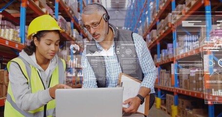 Warehouse team reviewing inventory on laptop at mobile workstation, with neon vest and hardhat