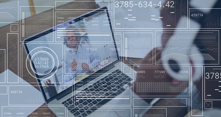 Displaying laptop hosting meeting at office desk, colleague holding mug, tablet with data overlays