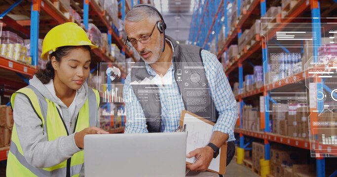Warehouse team reviewing inventory on laptop at mobile workstation, with neon vest and hardhat