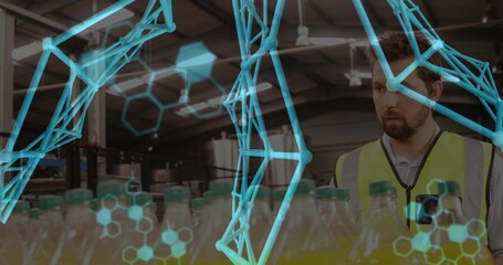 Factory technician in safety vest scanning bottles in plant, with data overlay, copy space