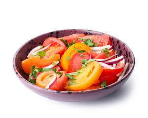 Bowl of fresh tomato salad with red onion and parsley on white background