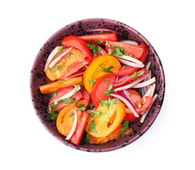 Bowl of fresh tomato salad with red onion and parsley on white background