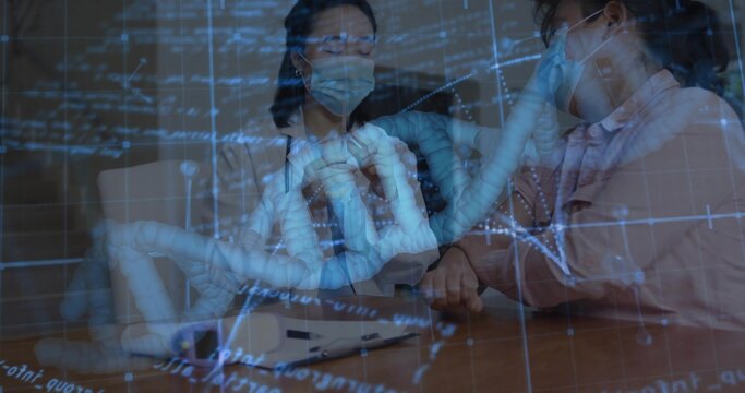 Discussing DNA Korean doctor and patient analyzing genetic data in clinic room, with stethoscope
