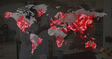 Displaying map with red hotspots over kitchen showing couple wearing aprons stirring frying pan