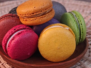 Sweet colorful of macarons on plate.