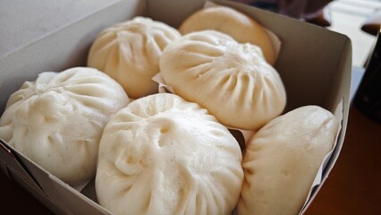 Steamed stuff buns in box.
