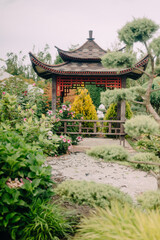 Charming Garden Shed with Lush Greenery and Blooming Flowers