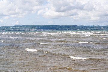 The stunning beach view in Southern Sweden and charming coastal town under a beautiful cloudy sky, Bostad, Sweden