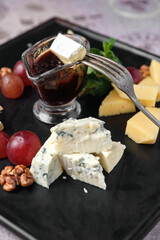 Cheese and fruit platter with dipping sauce