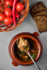 Delicious homemade soup served with fresh ingredients and bread.
