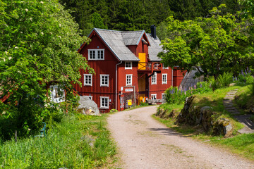 View at the old mill house by a river in a lush green forest Knared located in Southern Sweden.