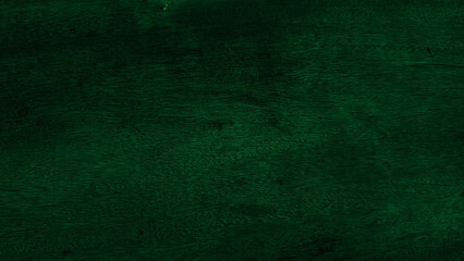 Dark green wood texture with vintage and aged feel. Surface heavily distressed and appears to have deep cracks and very fine detailed grain. Close-up broader area wooden surface