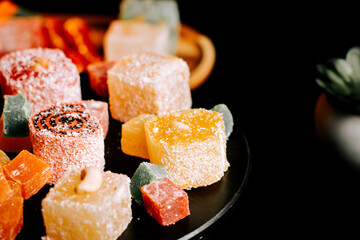 Delightful assortment of Turkish delights lokum on a black surface