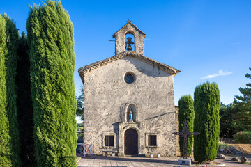 The chapel Sainte-Anne with cypress trees and statue of virgin mary in Lorgues, Provence, France