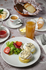 Delicious breakfast spread with eggs, bread, and juice.