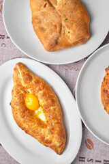 Georgian khachapuri on white plates