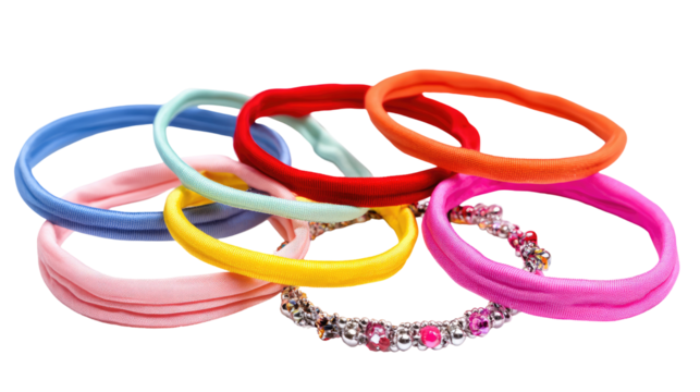 Colorful rubber bands of various shades, some with embellishments, layered together - Powered by Adobe