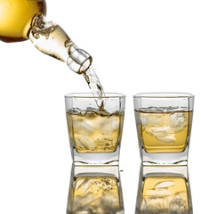 Pouring Whiskey from a bottle into a glass with ice on a white background.