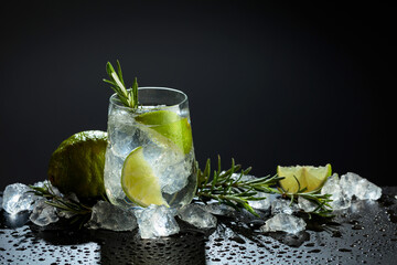 Gin and tonic cocktail made with dry gin, tonic water, lime, and ice.