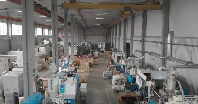 Shop with machines for production of plastic parts. Workshop of a plant for casting plastic products and metal processing. Inside. Plastic Injection Molding Machines. 