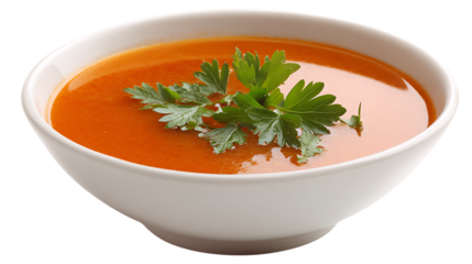 Bowl of tomato soup with parsley garnish isolated on transparent background