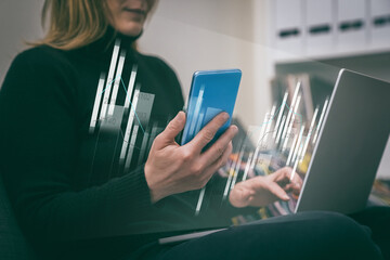 Financial analysis. Woman uses phone and laptop. Businesswoman analyzes and reviews economic data