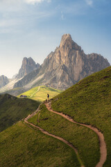 mountain landscape in the mountains with a woman making scale