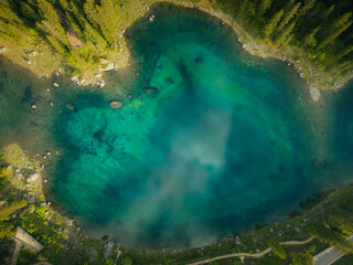 aerial view of an alpine lake di carezca with turquoise water
